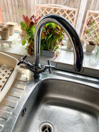 Picture of a kitchen tap with little water pressure